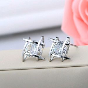 Round Caged Solitaire Diamond Earrings